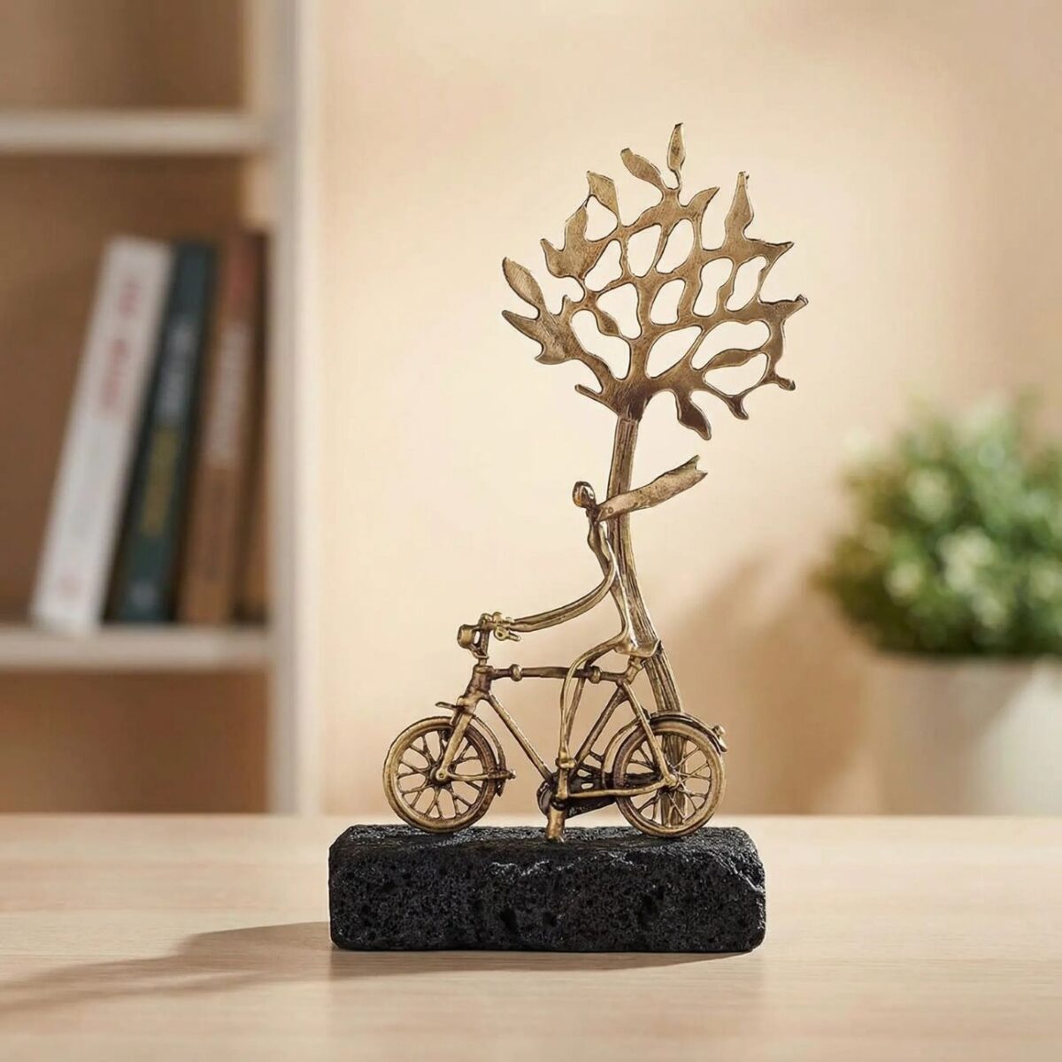 Bronze Between Wheels and Roots with Lava Stone Base
